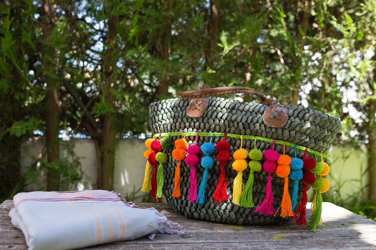 Pompones para tu bolso de playa